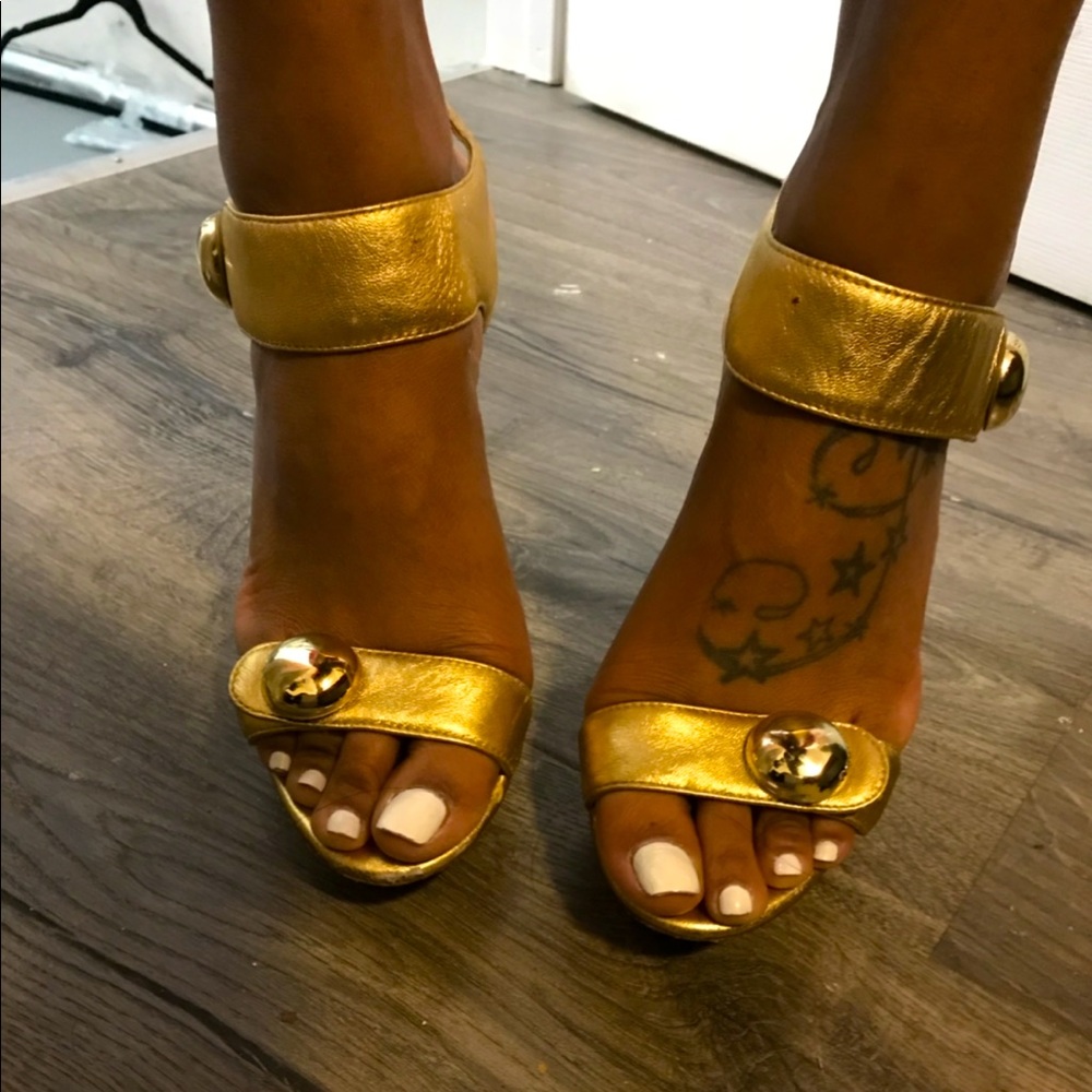 Bebe gold heels with gold buttons
